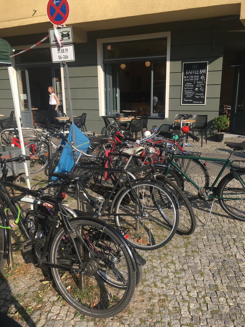 Red bell stands out in a group of bicycles